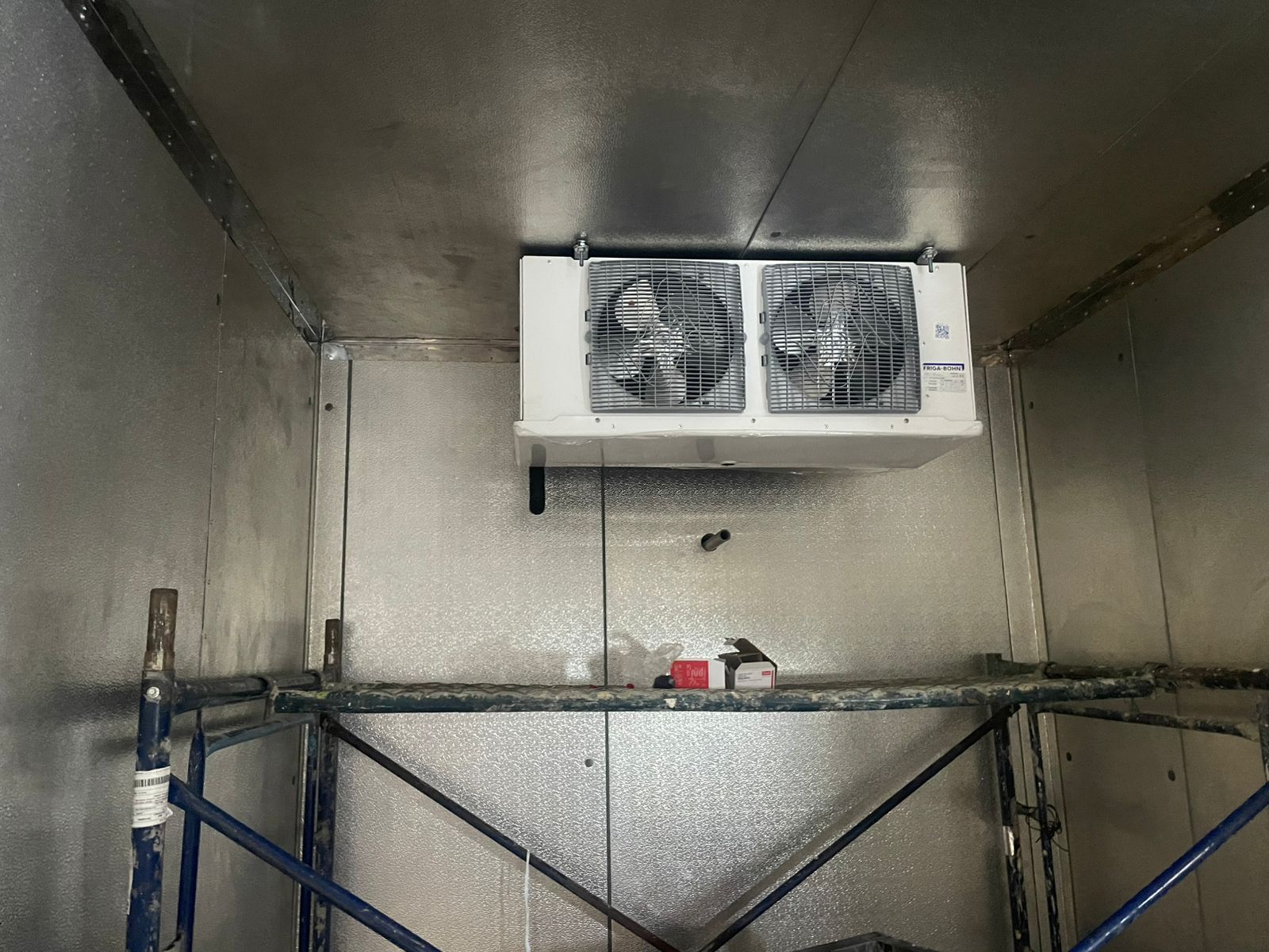 Twin-fan Friga-Bohn ceiling unit cooler installed in a newly built insulated cold room