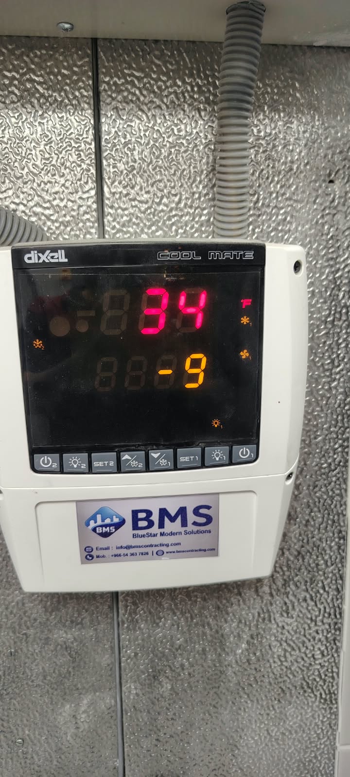 Cold-room temperature controller showing chiller and freezer set points after commissioning