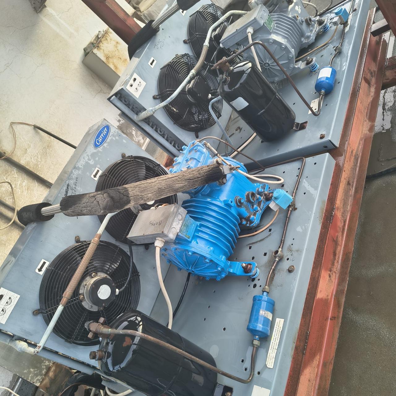 Rooftop condensing units on a steel frame with compressors, receivers and filter driers