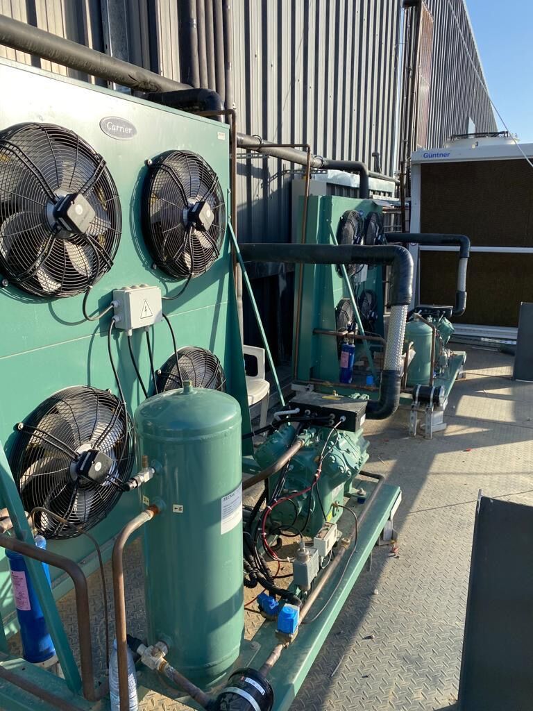 Condensing units on a rooftop rack